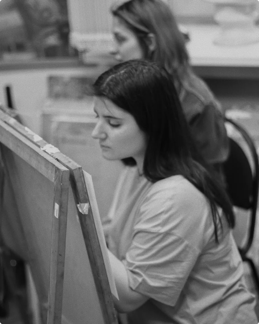 Polina Khayutina drawing at an easel